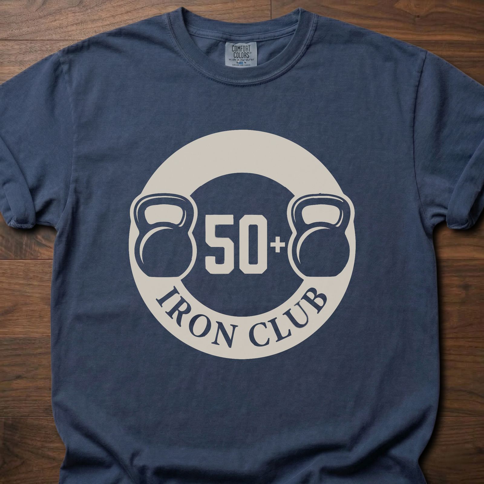 50+ Iron Club strength training t-shirt featuring kettlebells and circular badge design – Navy