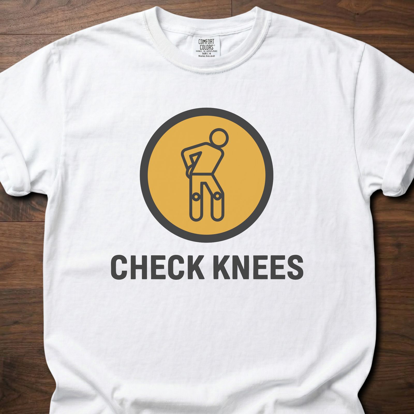Check Knees strength training t-shirt with figure holding knee in circular badge design – White