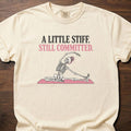 A Little Stiff funny gym shirt with retro bold type and illustrated fitness graphic – Ivory