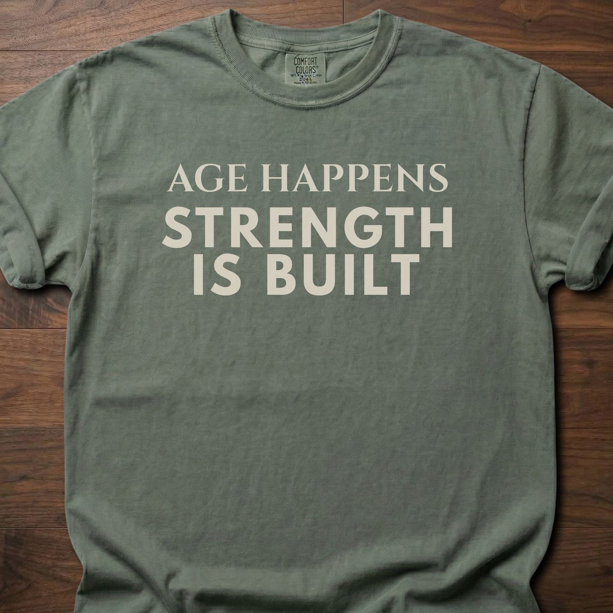 Age Happens strength training t-shirt with clean bold typographic graphic – Moss