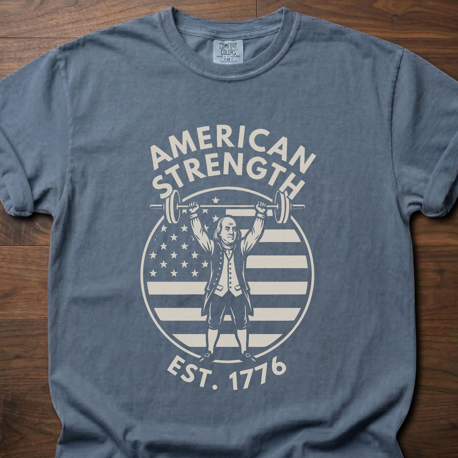 American Strength strength training t-shirt featuring Benjamin Franklin lifting barbell with flag design – Blue Jean