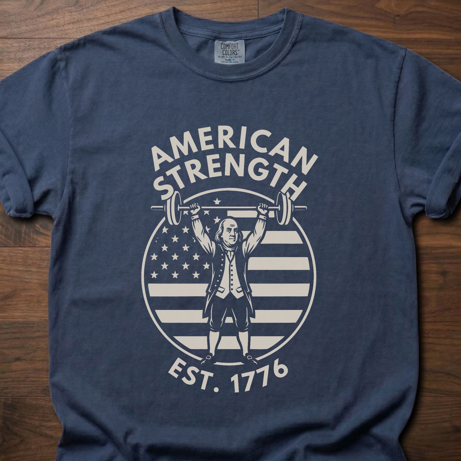American Strength strength training t-shirt featuring Benjamin Franklin lifting barbell with flag design – Navy