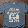 Bad Knees Good Gains strength training t-shirt featuring weightlifter doing barbell squat – Blue Jean