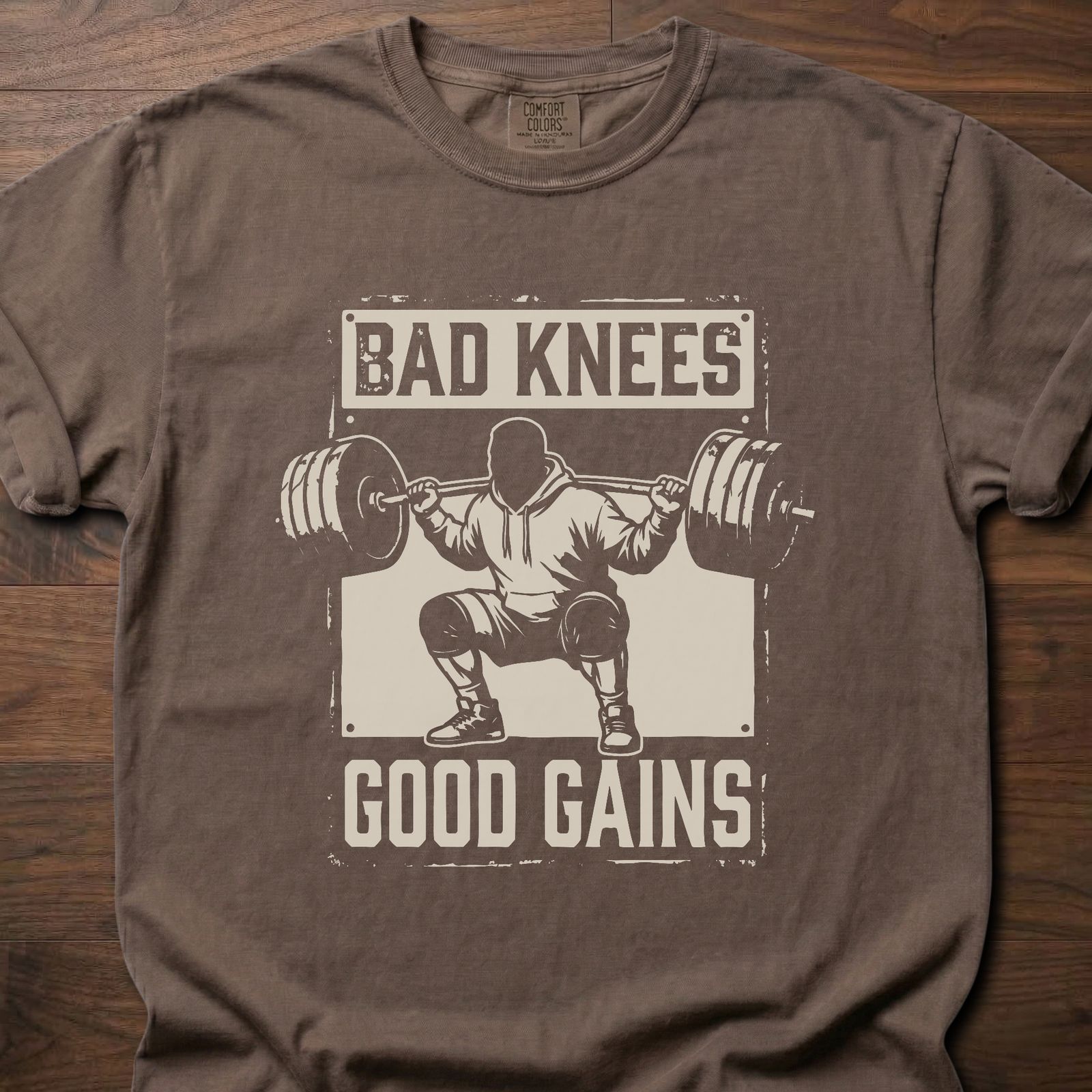 Bad Knees Good Gains strength training t-shirt featuring weightlifter doing barbell squat – Espresso