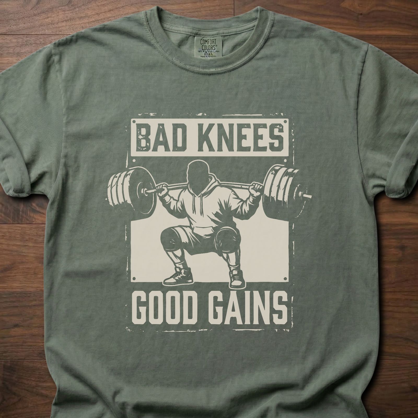 Bad Knees Good Gains strength training t-shirt featuring weightlifter doing barbell squat – Moss