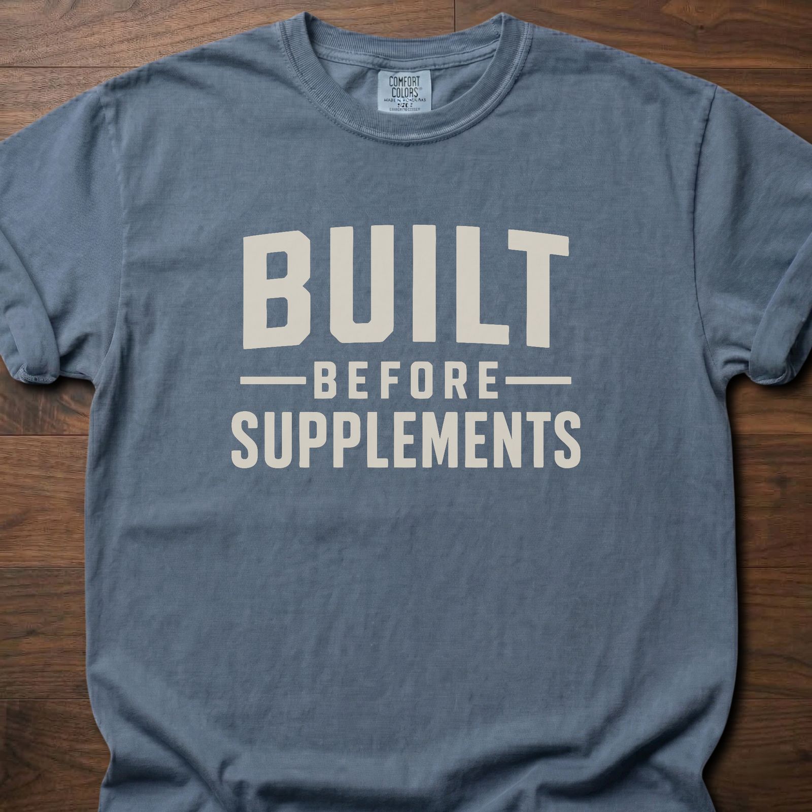 Built Before Supplements strength training lifestyle shirt with bold stacked block lettering – Blue Jean