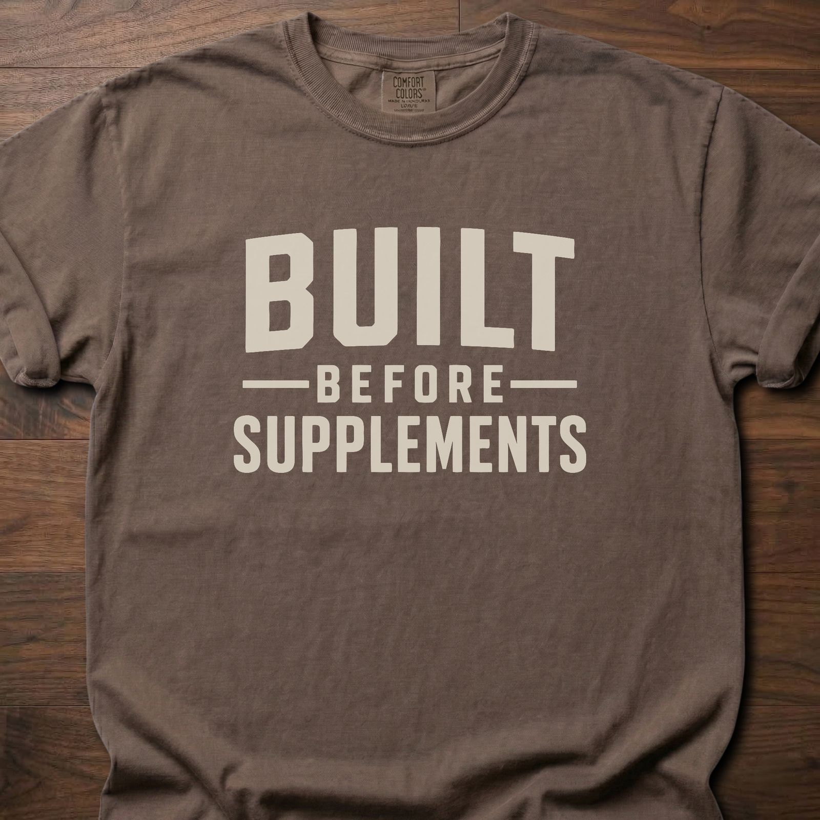 Built Before Supplements strength training lifestyle shirt with bold stacked block lettering – Espresso
