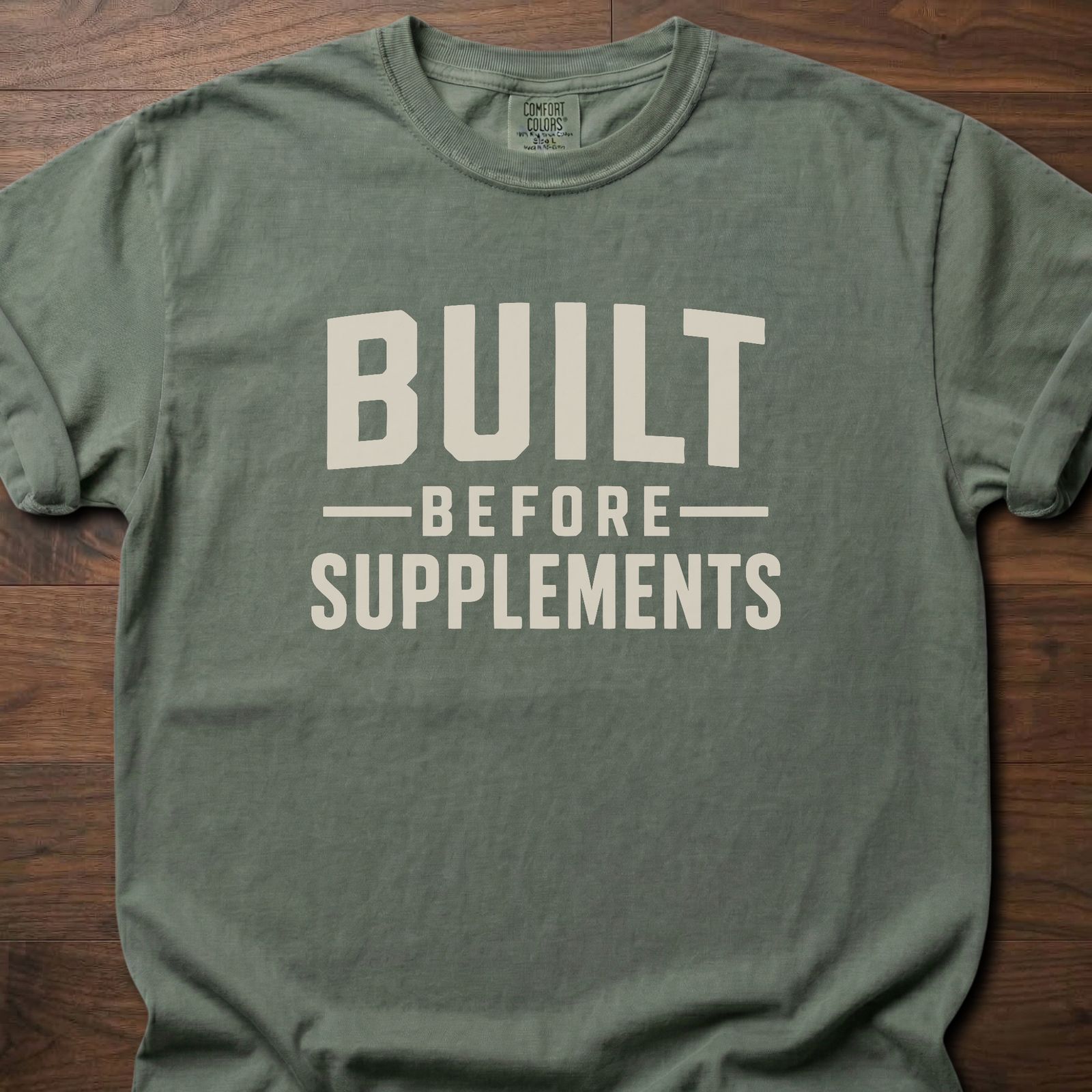 Built Before Supplements strength training lifestyle shirt with bold stacked block lettering – Moss