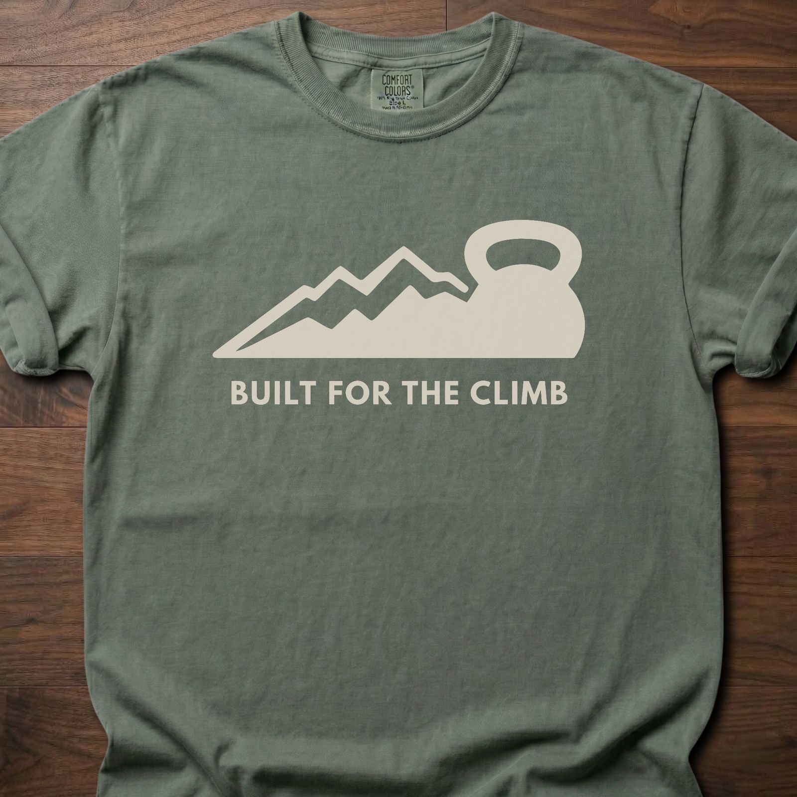 Built For The Climb strength training t-shirt with mountain and kettlebell design – Moss