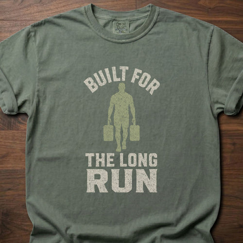 Built For The Long Run fitness lifestyle t-shirt with a figure carrying loaded farmer's walk handles – Moss