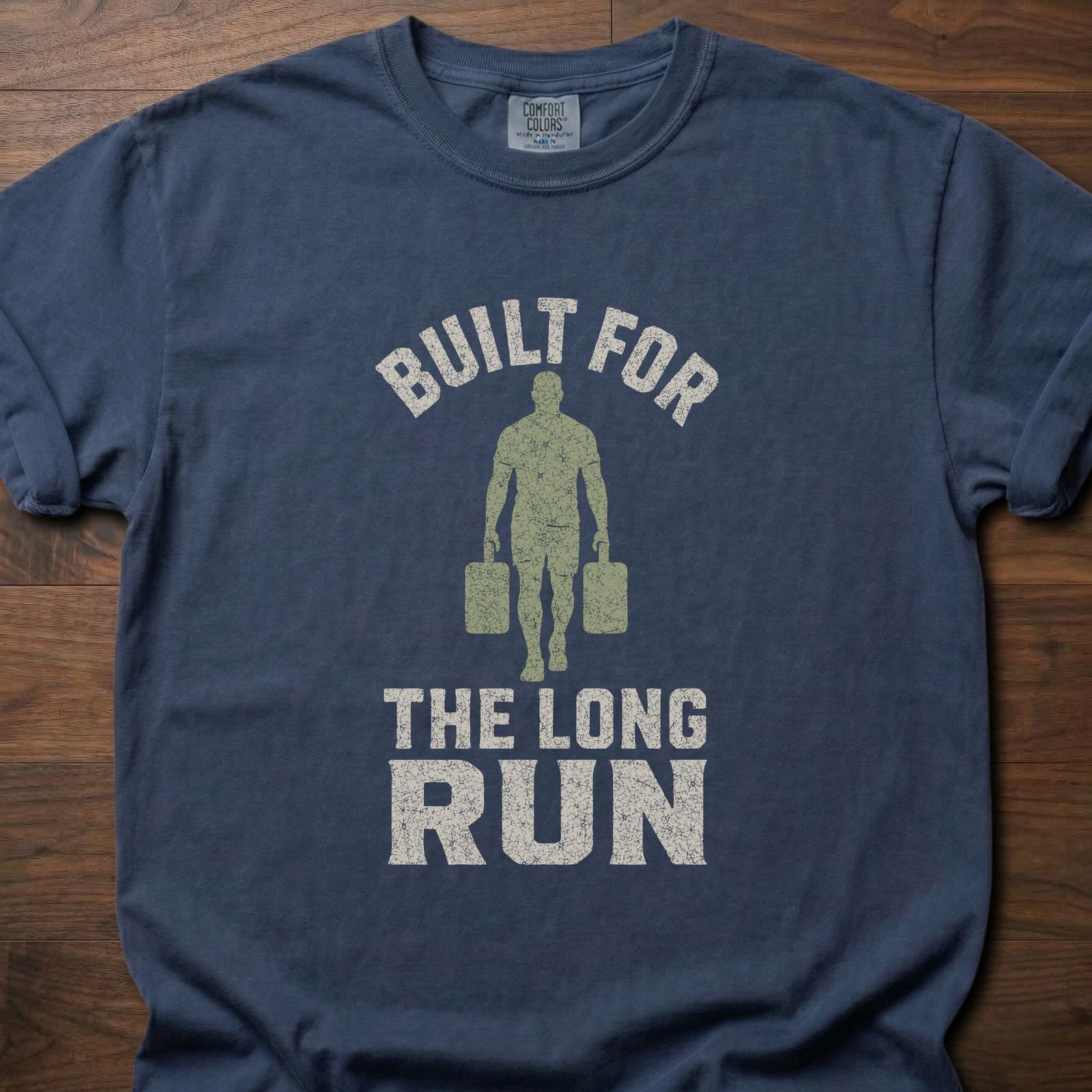 Built For The Long Run fitness lifestyle t-shirt with a figure carrying loaded farmer's walk handles – Navy