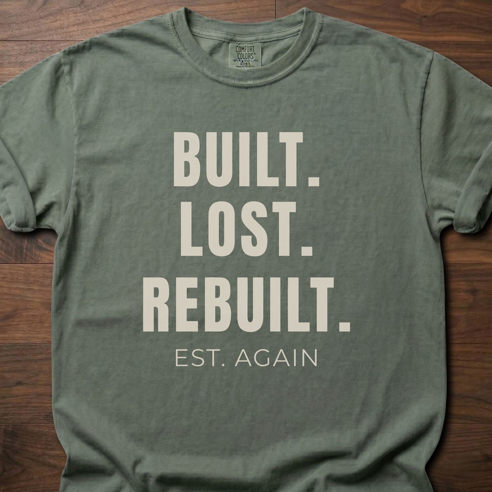Built Lost Rebuilt strength training lifestyle clothing with resilience message EST. AGAIN tagline – Moss