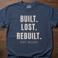 Built Lost Rebuilt strength training lifestyle clothing with resilience message EST. AGAIN tagline – Navy