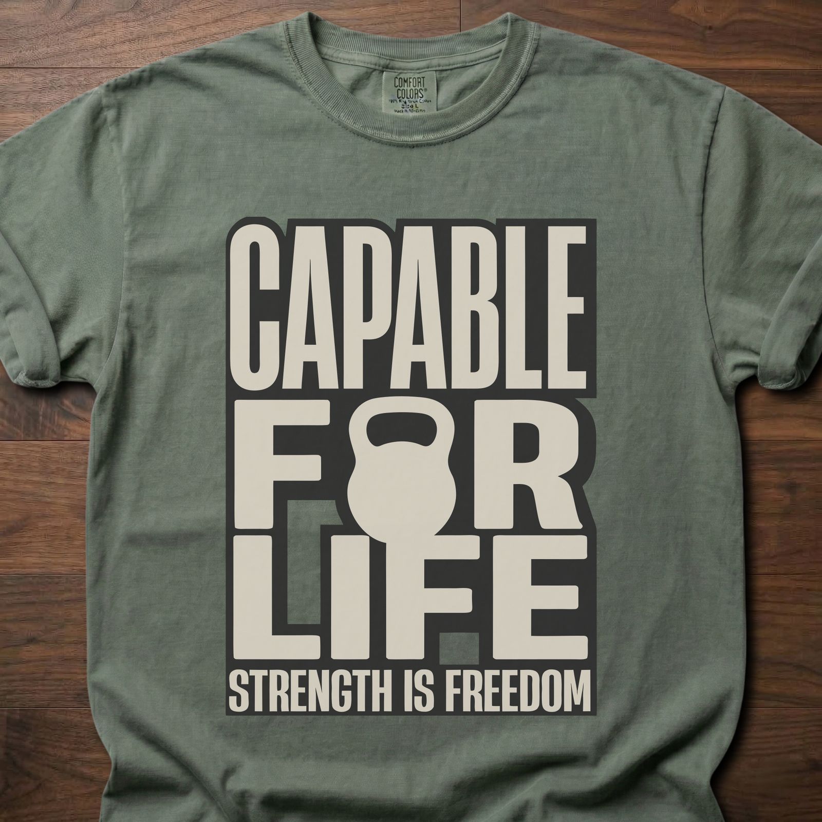 Capable For Life strength training t shirt with kettlebell silhouette and bold typography – Moss