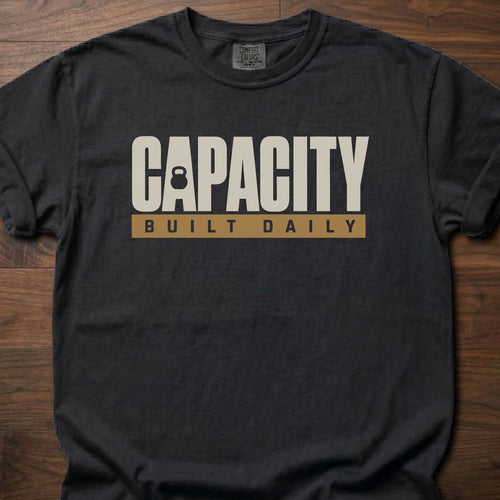Capacity Built Daily longevity fitness apparel with bold text and kettlebell graphic – Black