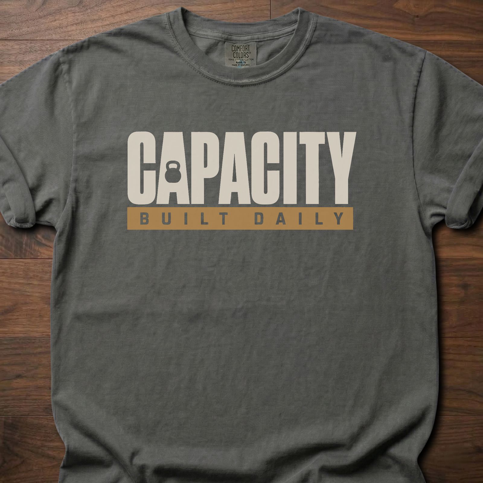 Capacity Built Daily longevity fitness apparel with bold text and kettlebell graphic – Pepper