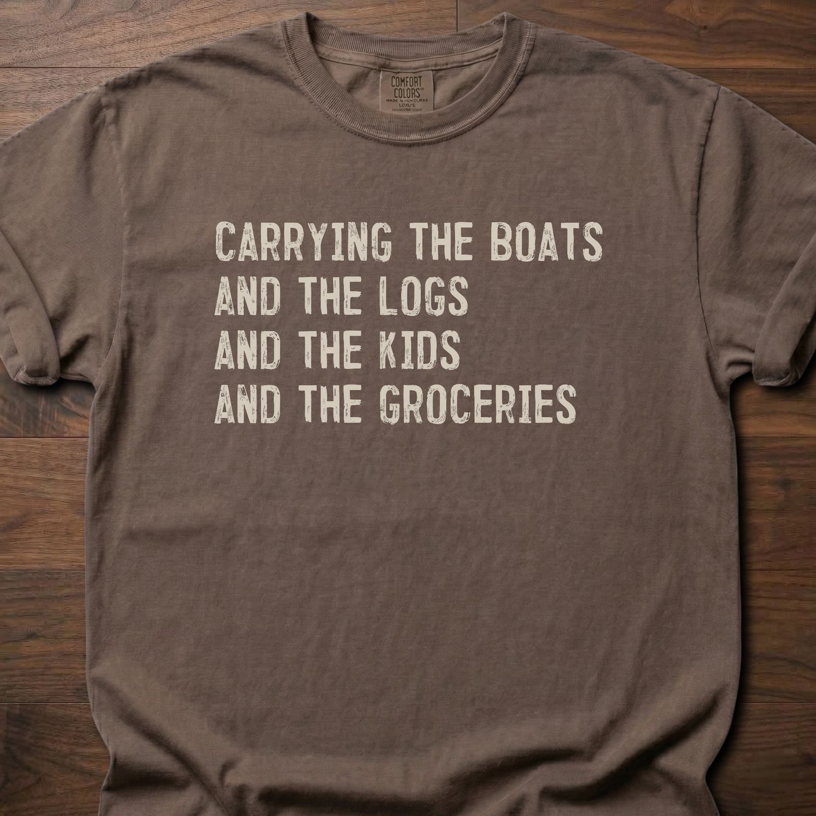 Carrying The Boats strength training t shirt with stacked list of daily carries – Espresso