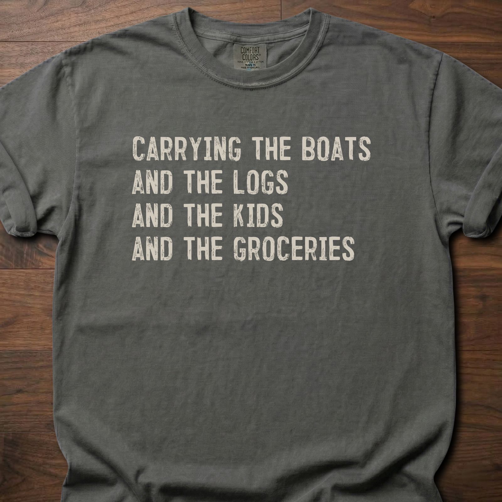 Carrying The Boats strength training t shirt with stacked list of daily carries – Pepper