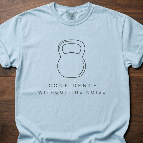 Confidence Without The Noise gym lifestyle shirt featuring minimalist kettlebell outline design – Chambray