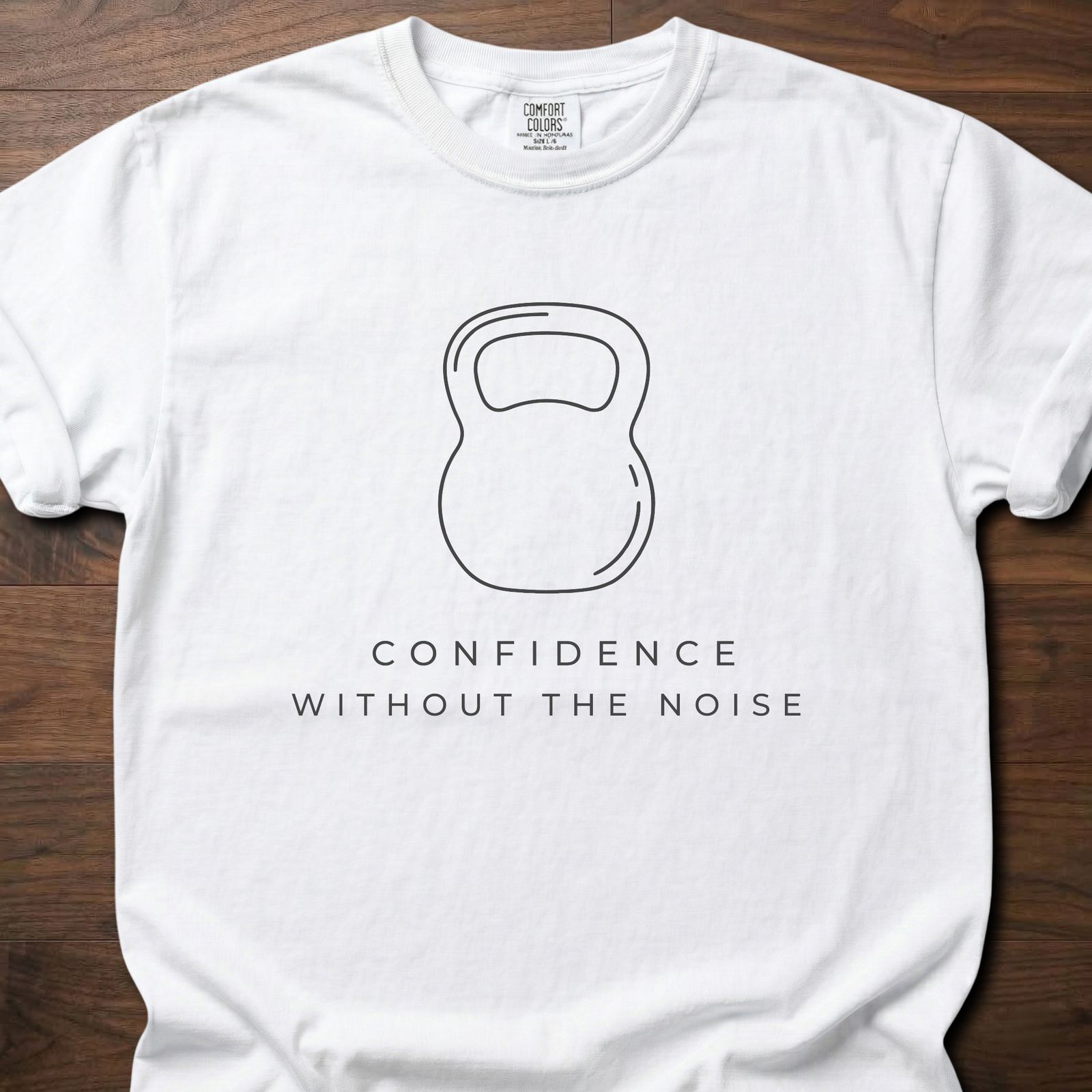 Confidence Without The Noise gym lifestyle shirt featuring minimalist kettlebell outline design – White
