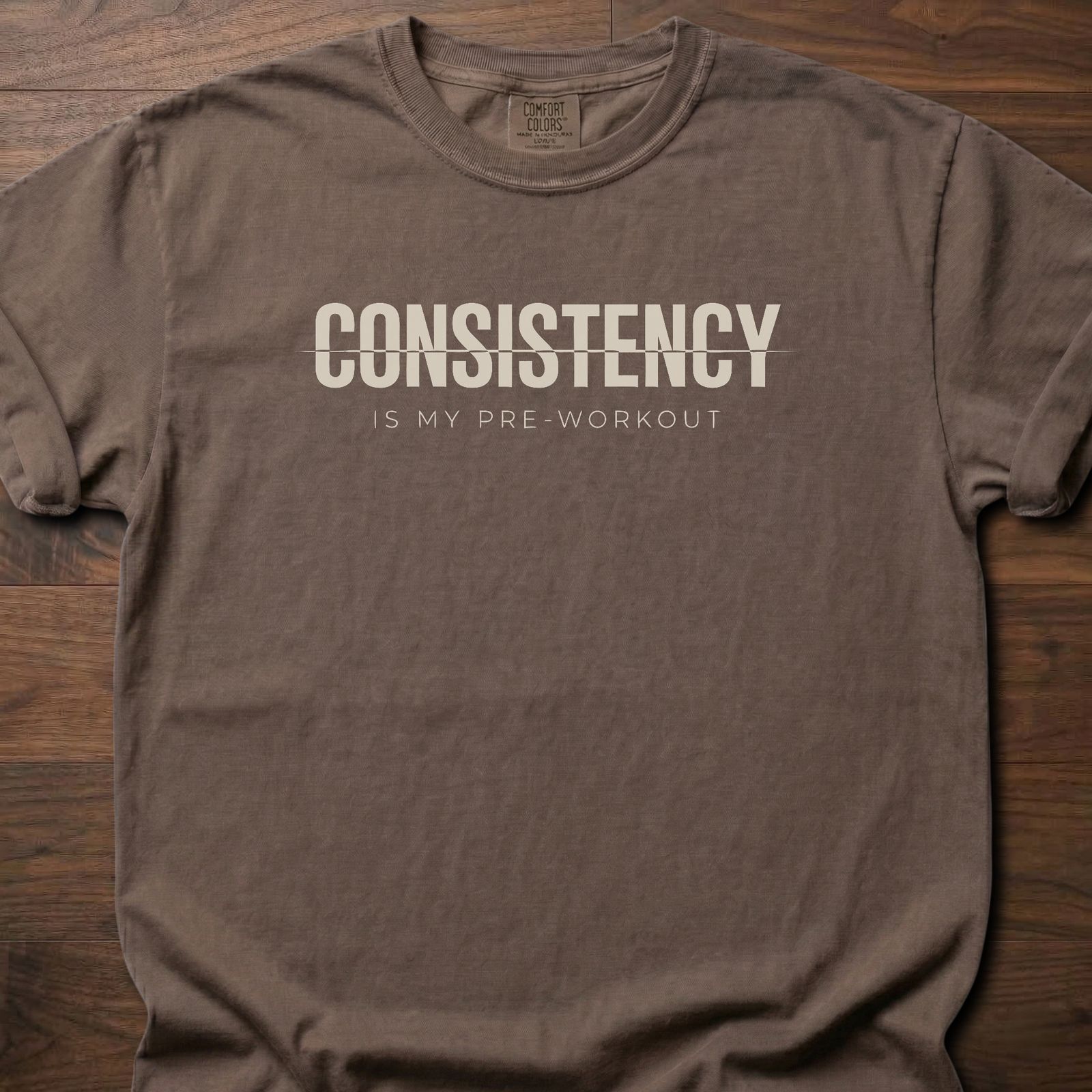 Consistency fitness lifestyle t-shirt with bold text and pre-workout message – Espresso