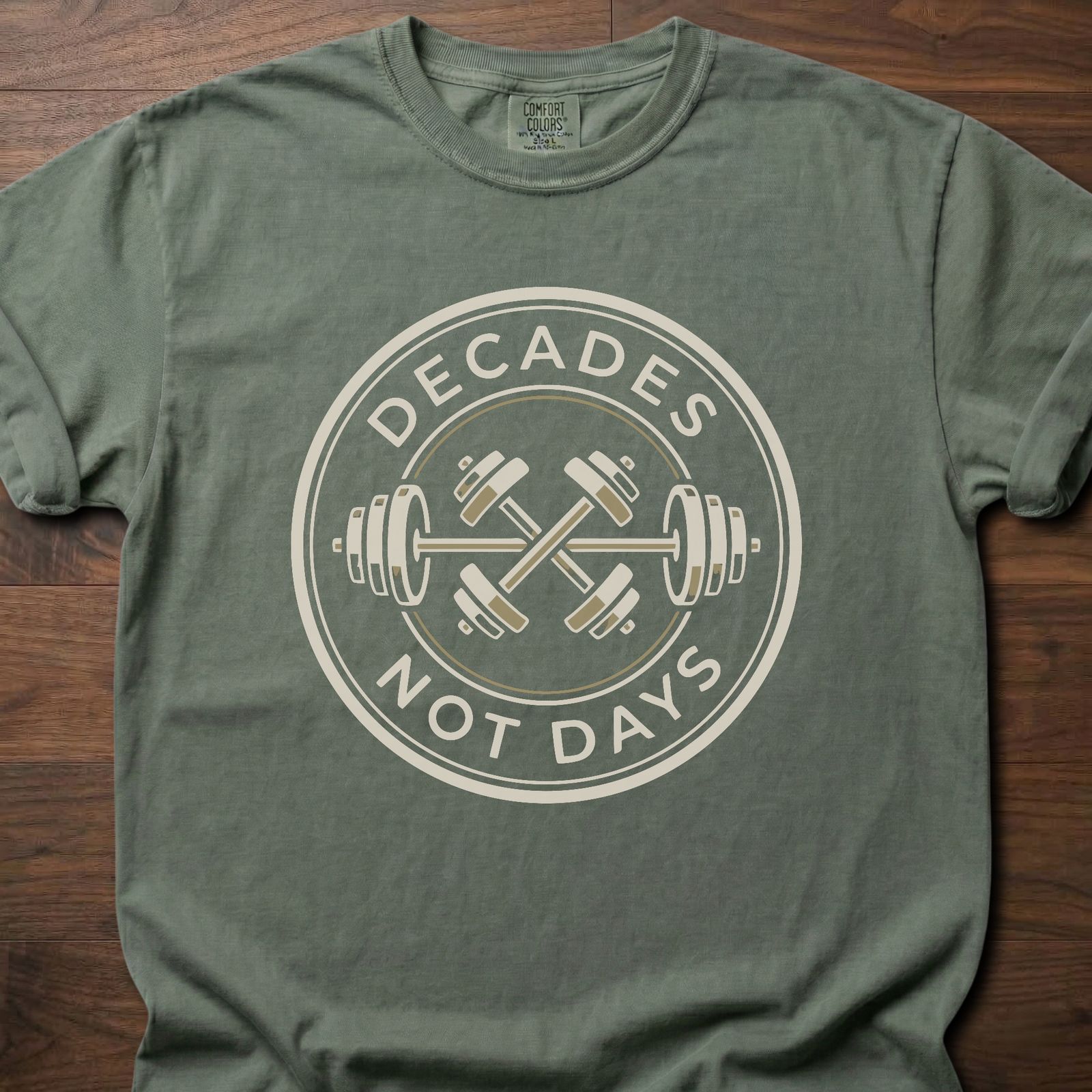 Decades Not Days strength training lifestyle clothing with circular barbell and dumbbell design – Moss