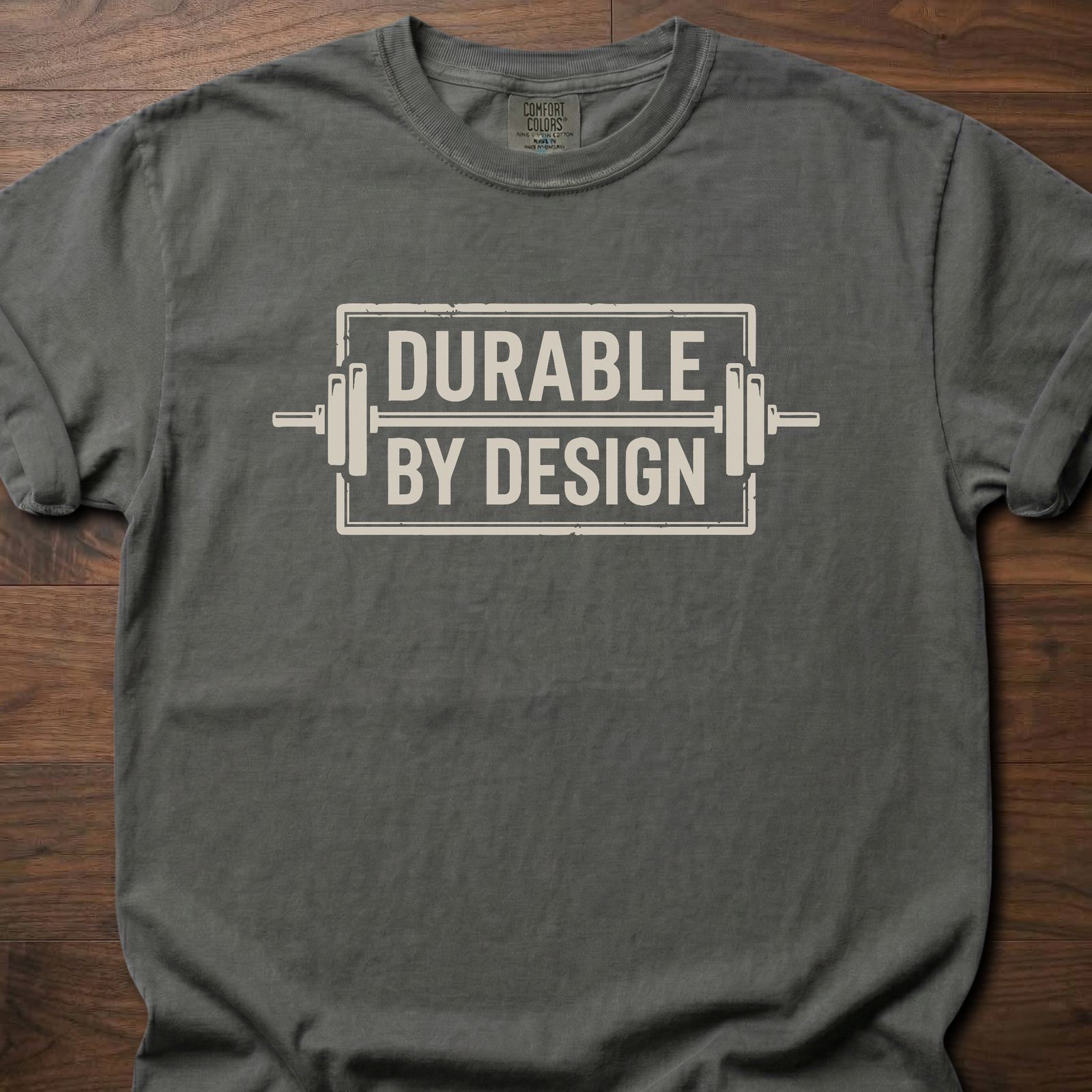 Durable By Design fitness lifestyle t shirt with bold rectangular logo and industrial frame graphic – Pepper