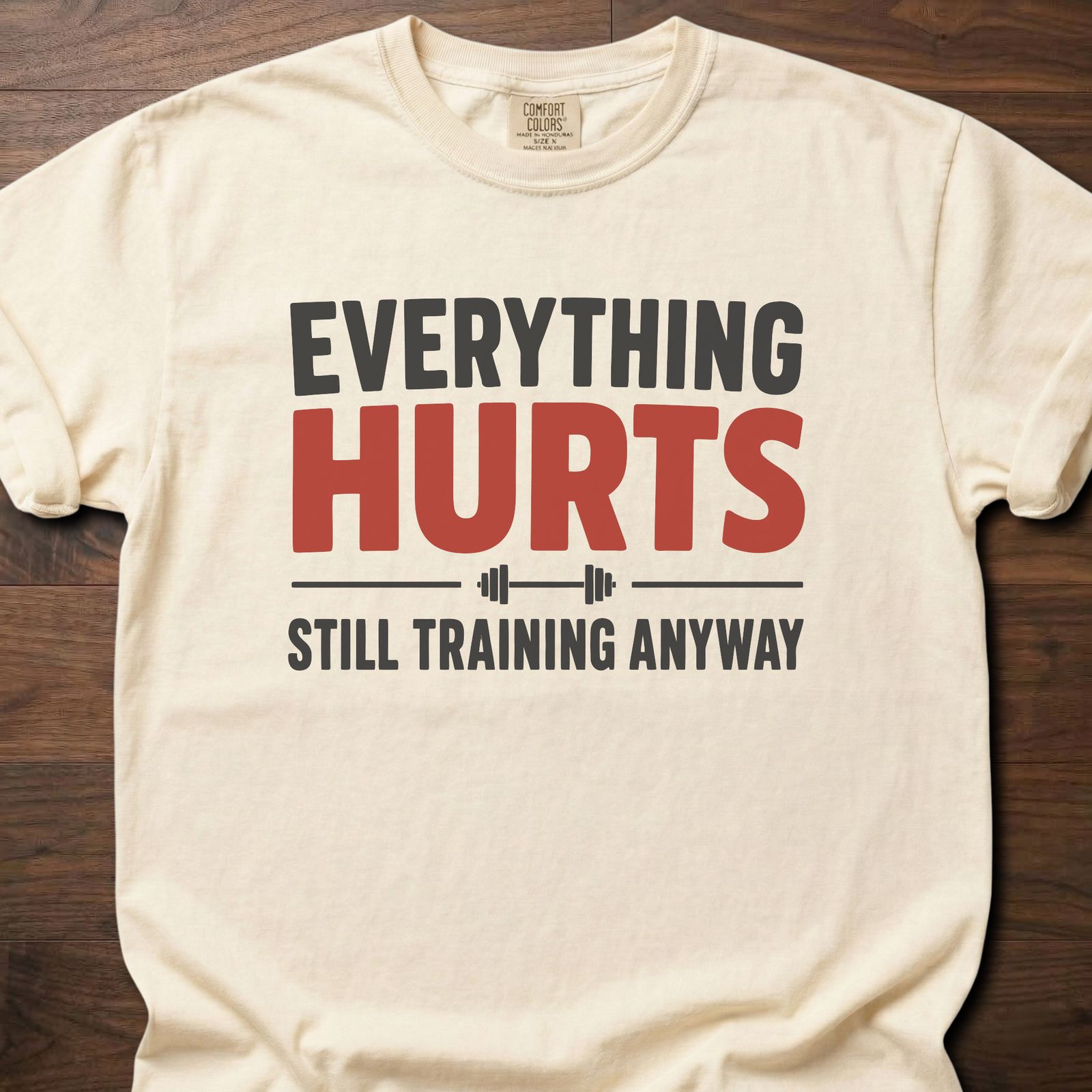 Everything Hurts strength training t-shirt with bold text and barbell graphic – Ivory