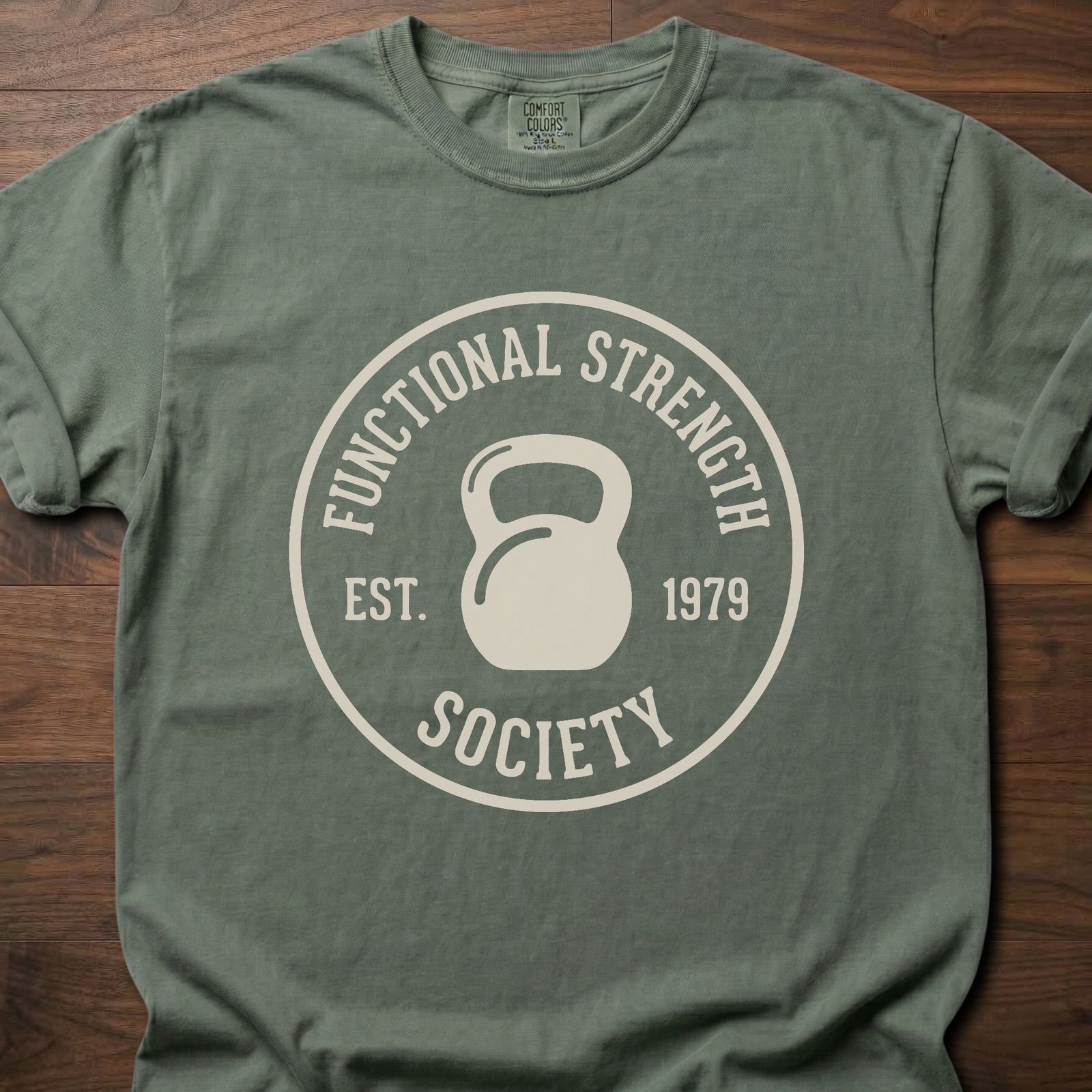 Functional Strength Society gym lifestyle shirt featuring kettlebell logo and established 1979 badge – Moss