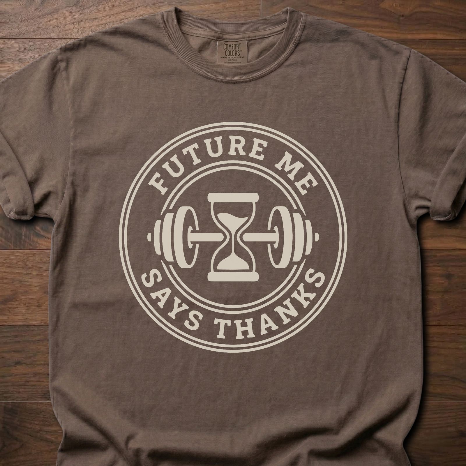 Future Me strength training t-shirt with hourglass and barbell design in circular badge – Espresso