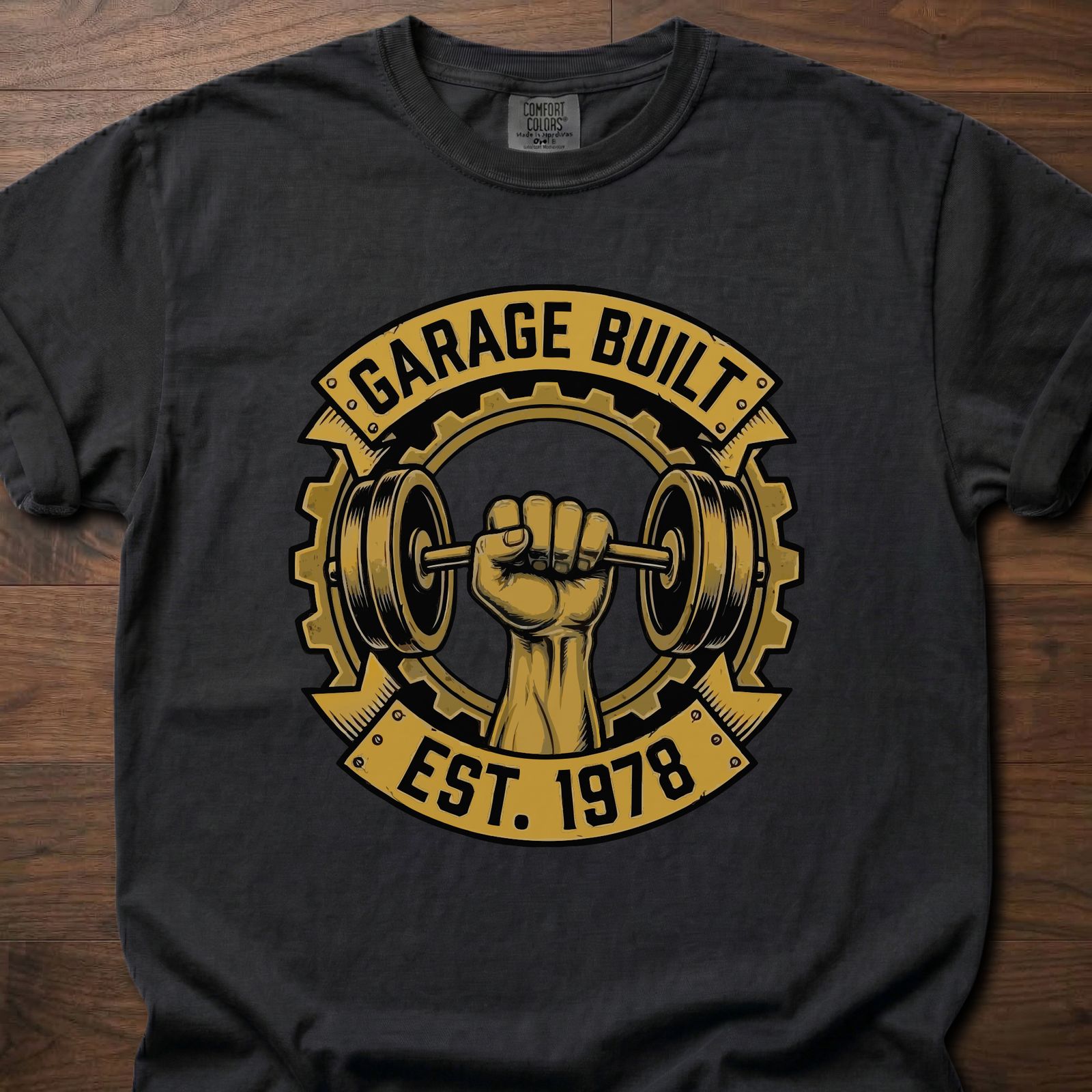 Garage Built gym lifestyle shirt featuring muscular fist gripping barbell with gear emblem EST. 1978 – Black
