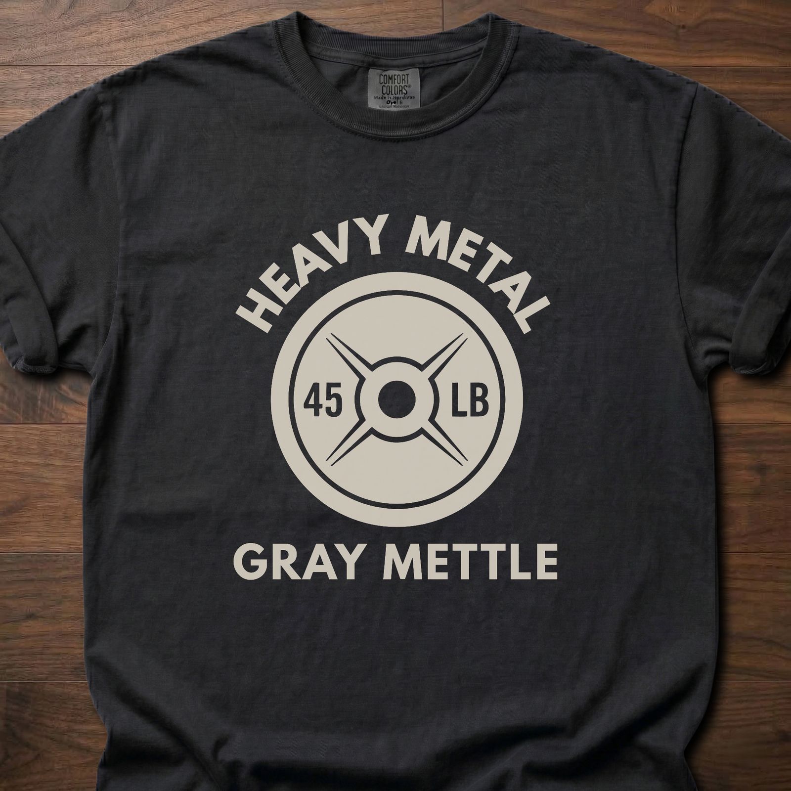 Gray Mettle strength training t-shirt featuring 45 lb weight plate design with Heavy Metal text – Black