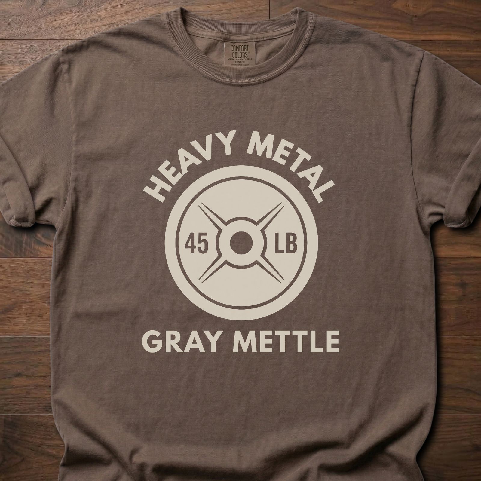 Gray Mettle strength training t-shirt featuring 45 lb weight plate design with Heavy Metal text – Espresso