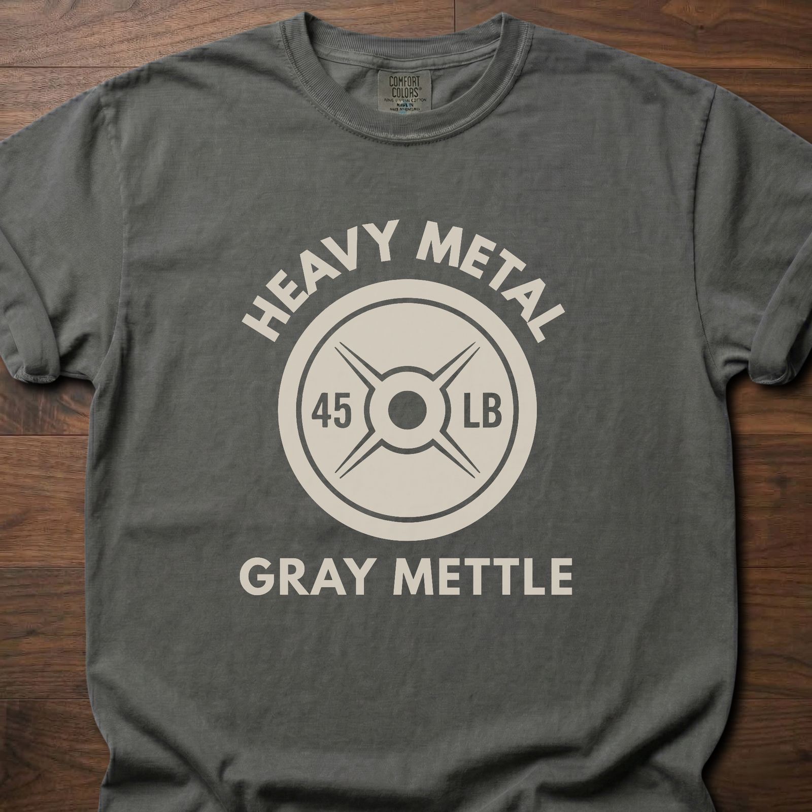 Gray Mettle strength training t-shirt featuring 45 lb weight plate design with Heavy Metal text – Pepper