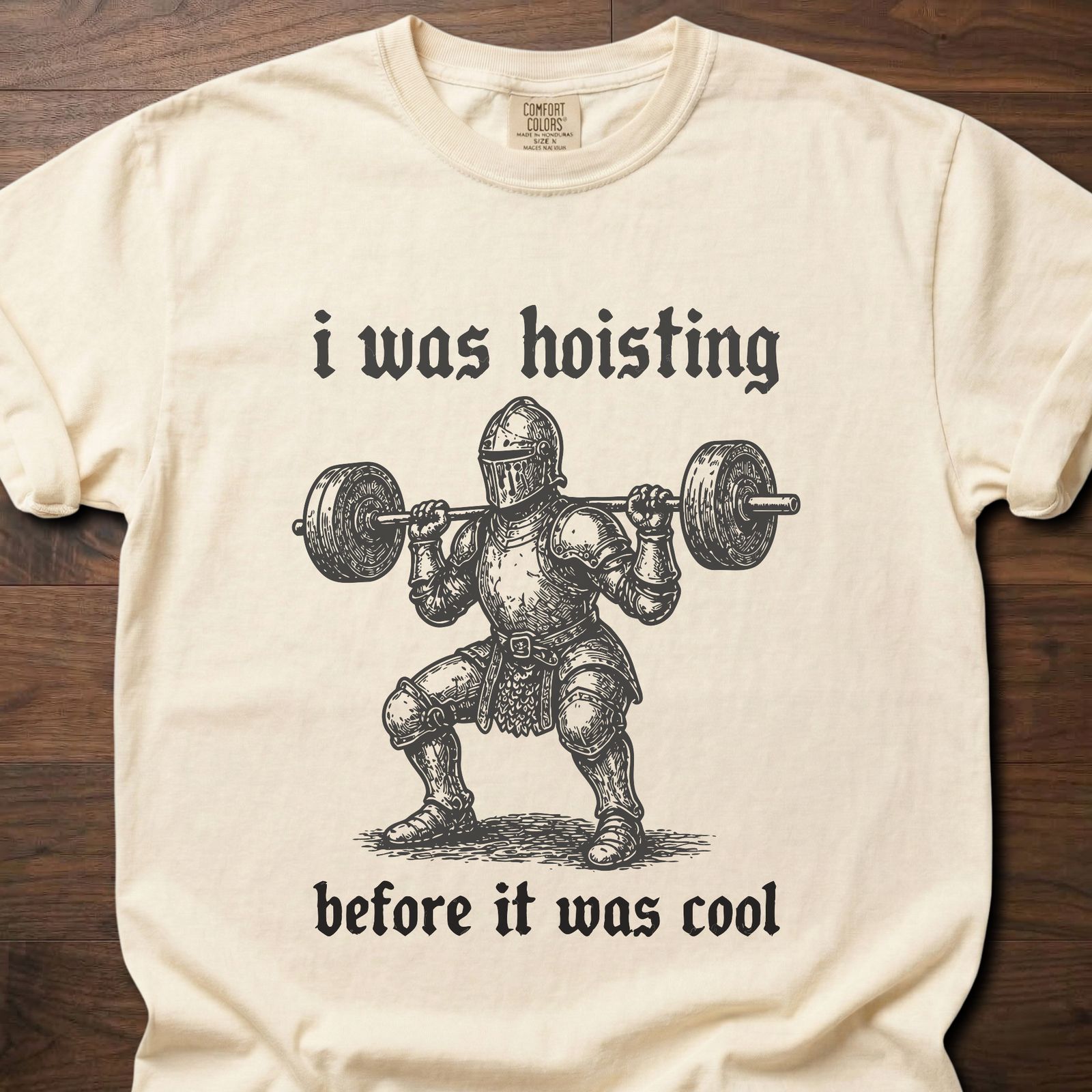 I Was Hoisting strength training lifestyle clothing featuring knight with barbell design – Ivory