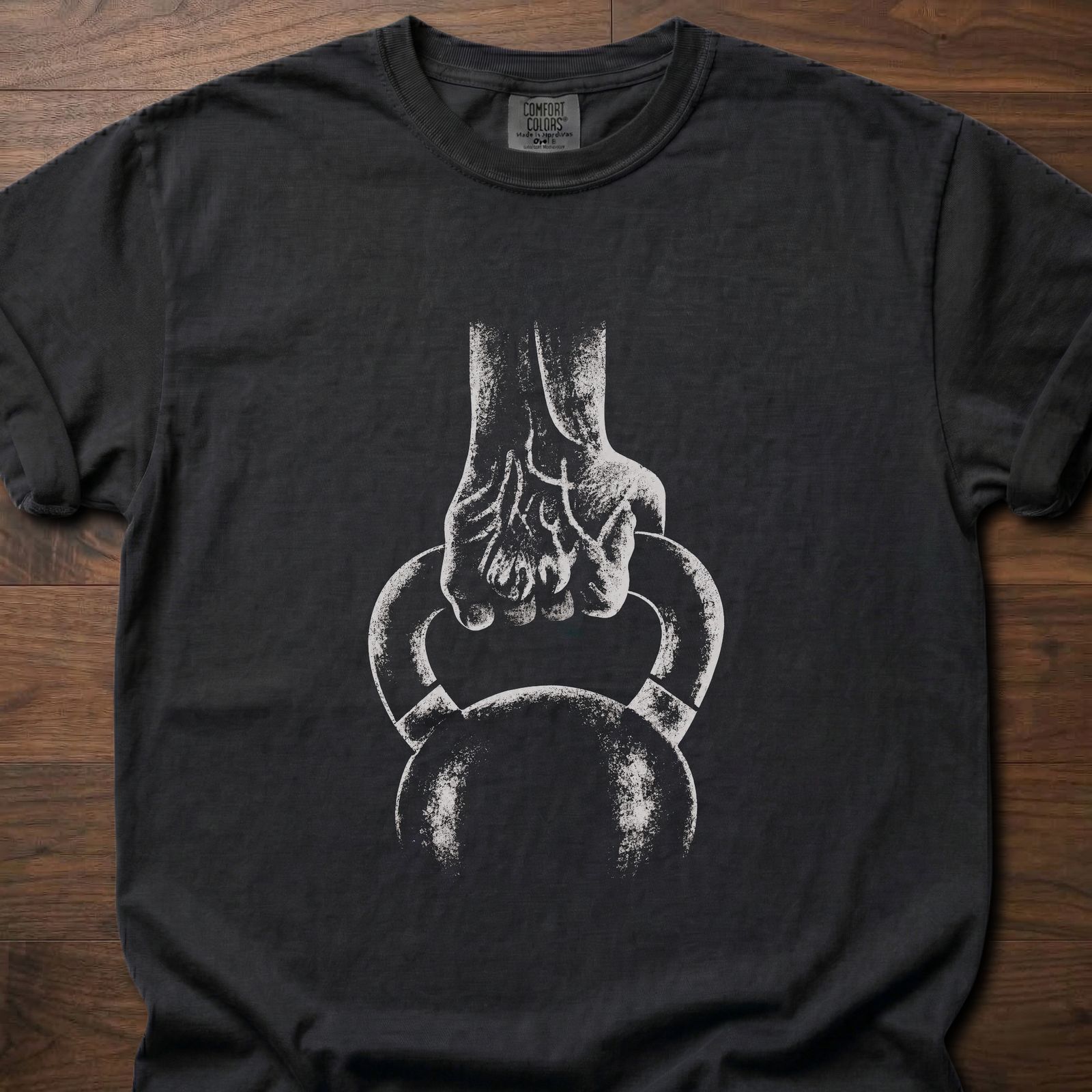 Kettlebell T-Shirt with hand gripping kettlebell design for strength training lifestyle clothing – Black