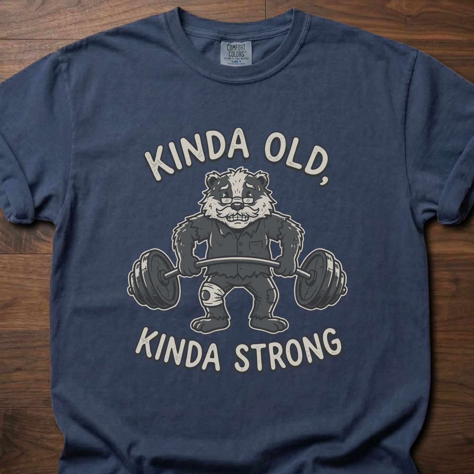 Kinda Old Kinda Strong strength training t shirt featuring weightlifting badger with barbell – Navy