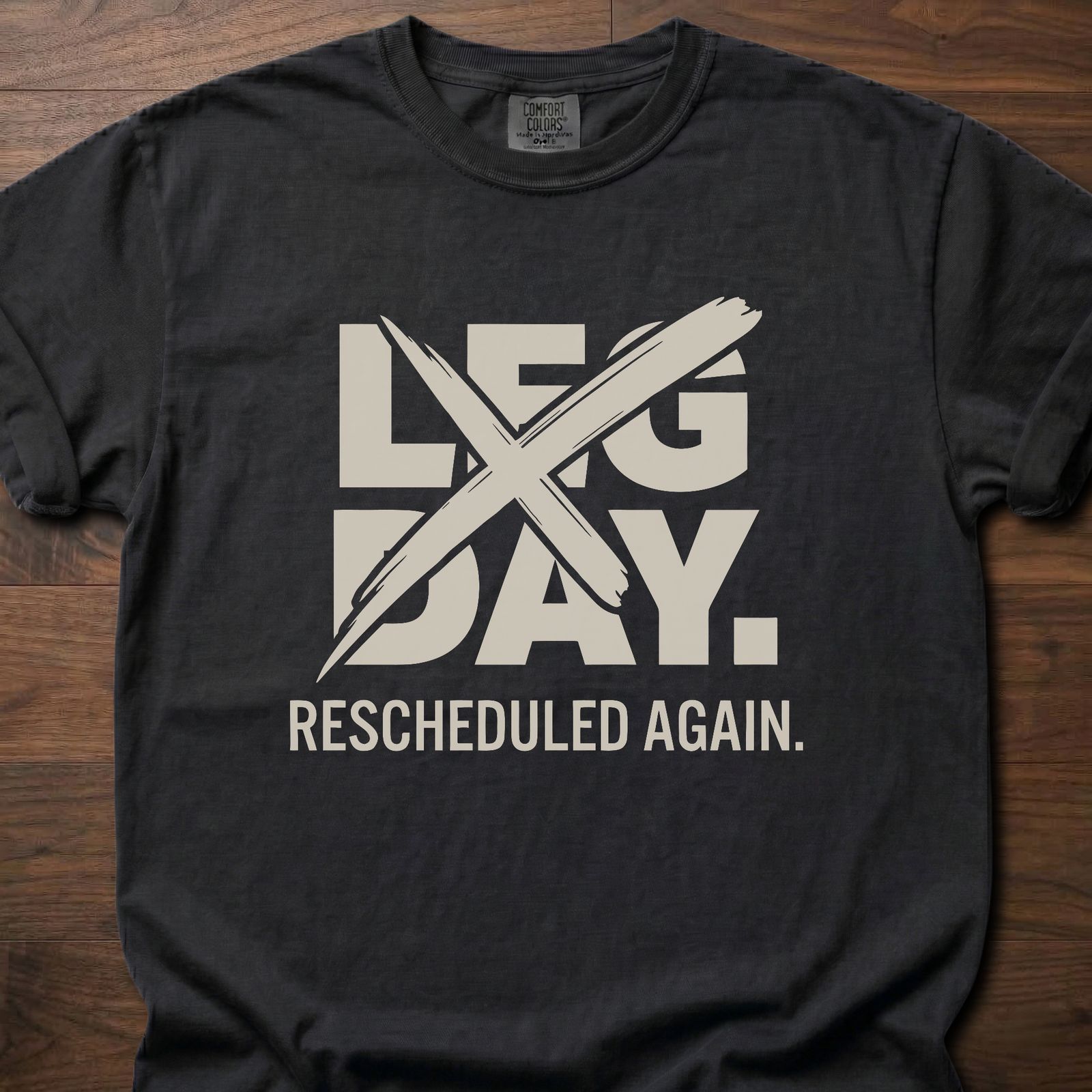 Leg Day strength training t-shirt with crossed out leg day and rescheduled again text – Black