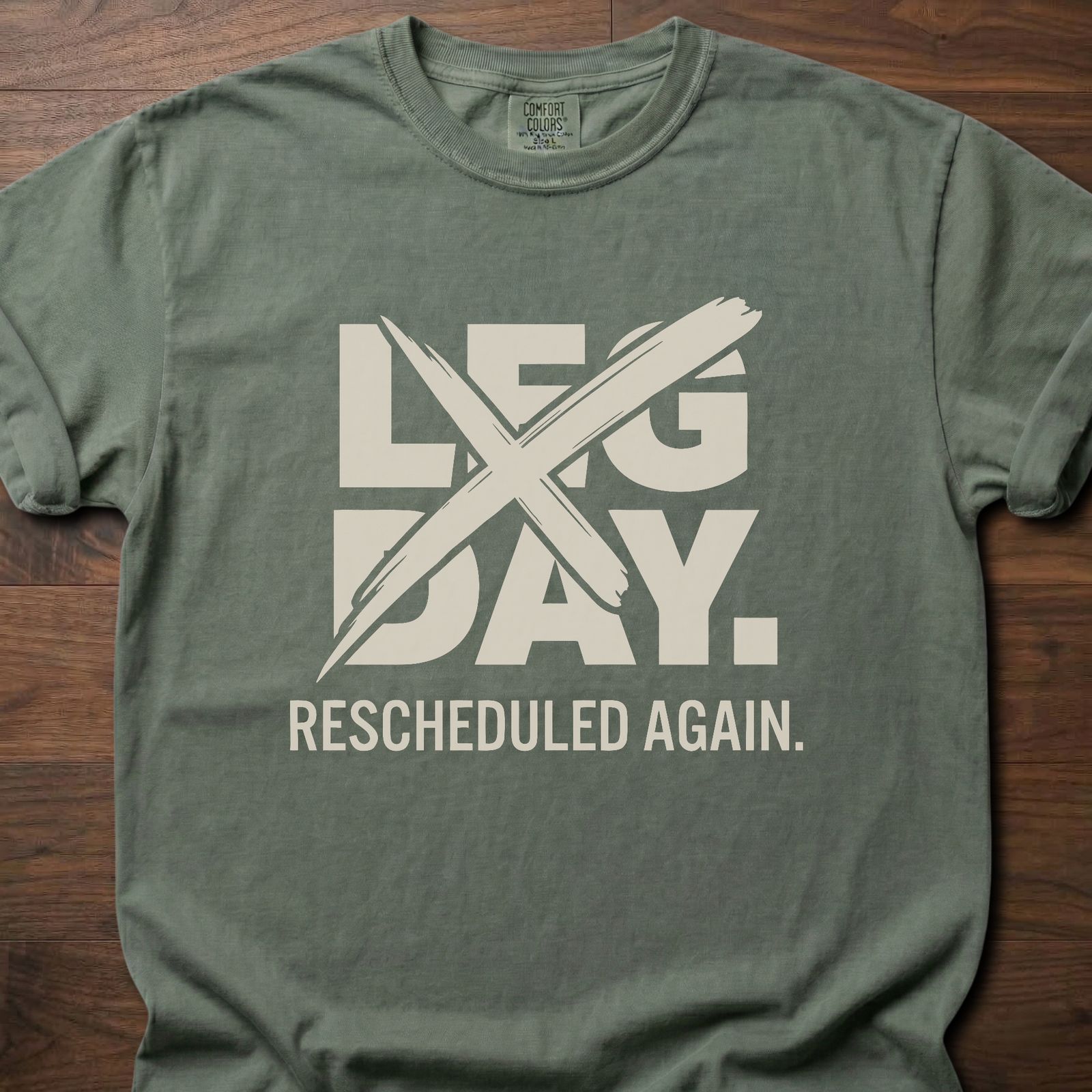 Leg Day strength training t-shirt with crossed out leg day and rescheduled again text – Moss