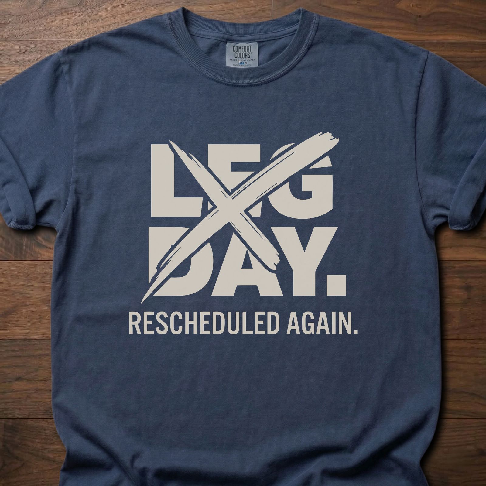 Leg Day strength training t-shirt with crossed out leg day and rescheduled again text – Navy