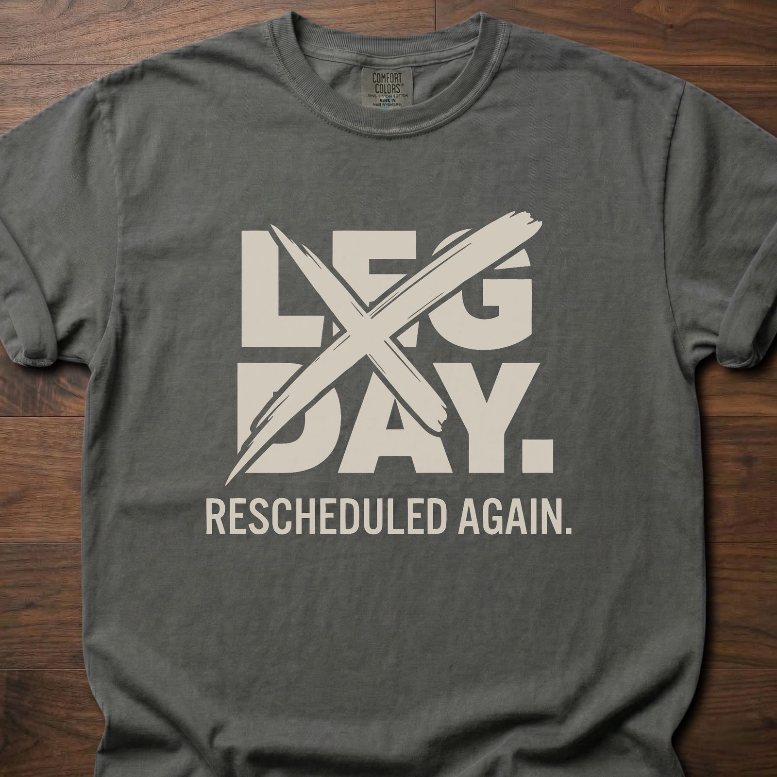 Leg Day strength training t-shirt with crossed out leg day and rescheduled again text – Pepper