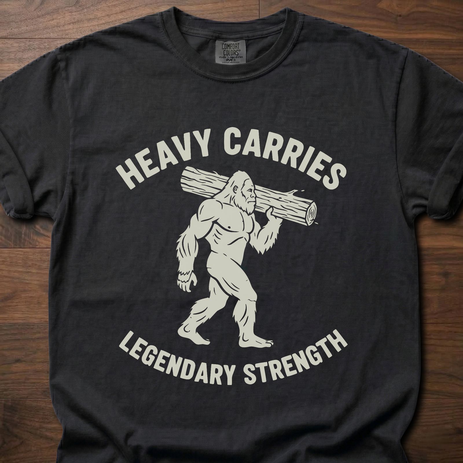 Legendary Strength strength training t-shirt featuring caveman carrying log graphic – Black