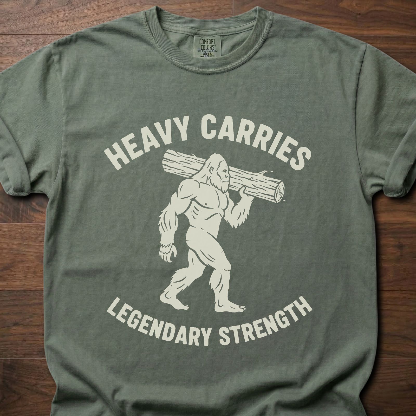 Legendary Strength strength training t-shirt featuring caveman carrying log graphic – Moss