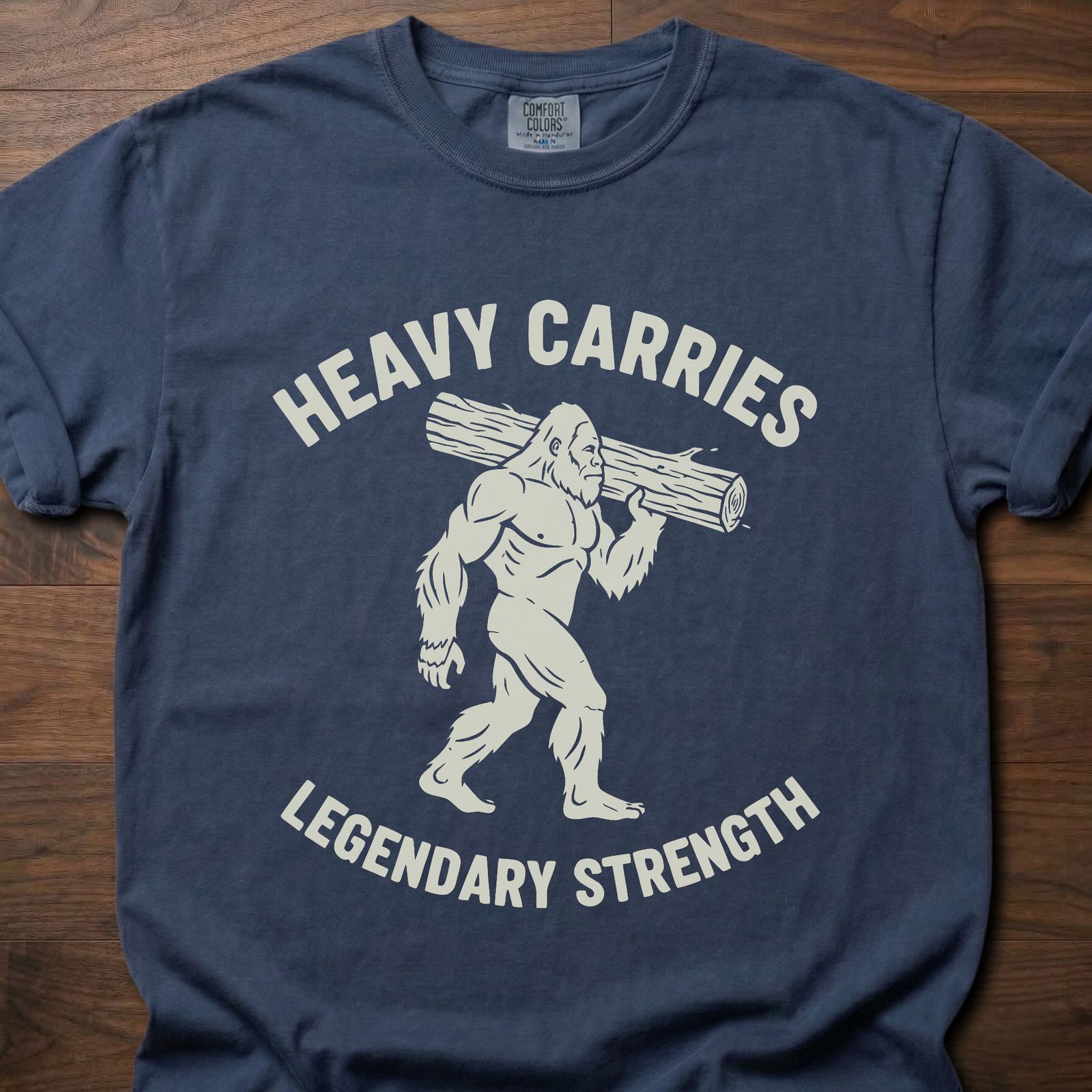 Legendary Strength strength training t-shirt featuring caveman carrying log graphic – Navy