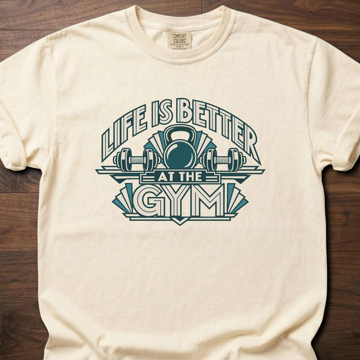 Life Is Better strength training t-shirt with bold retro athletic emblem graphic – Ivory