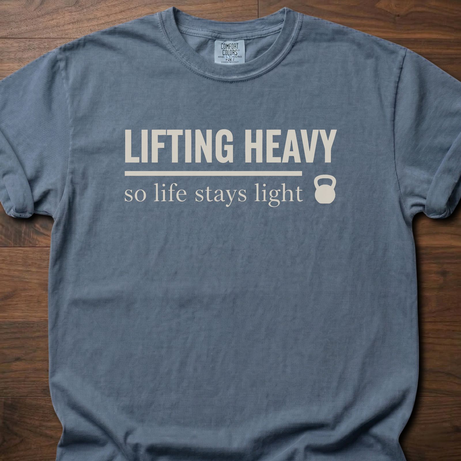 Life Stays Light strength training t shirt with kettlebell and motivational lifting message – Blue Jean