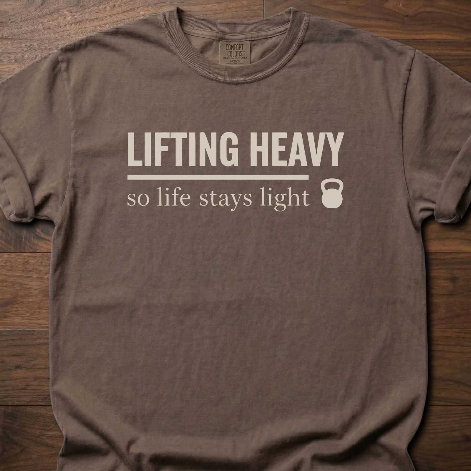 Life Stays Light strength training t shirt with kettlebell and motivational lifting message – Espresso