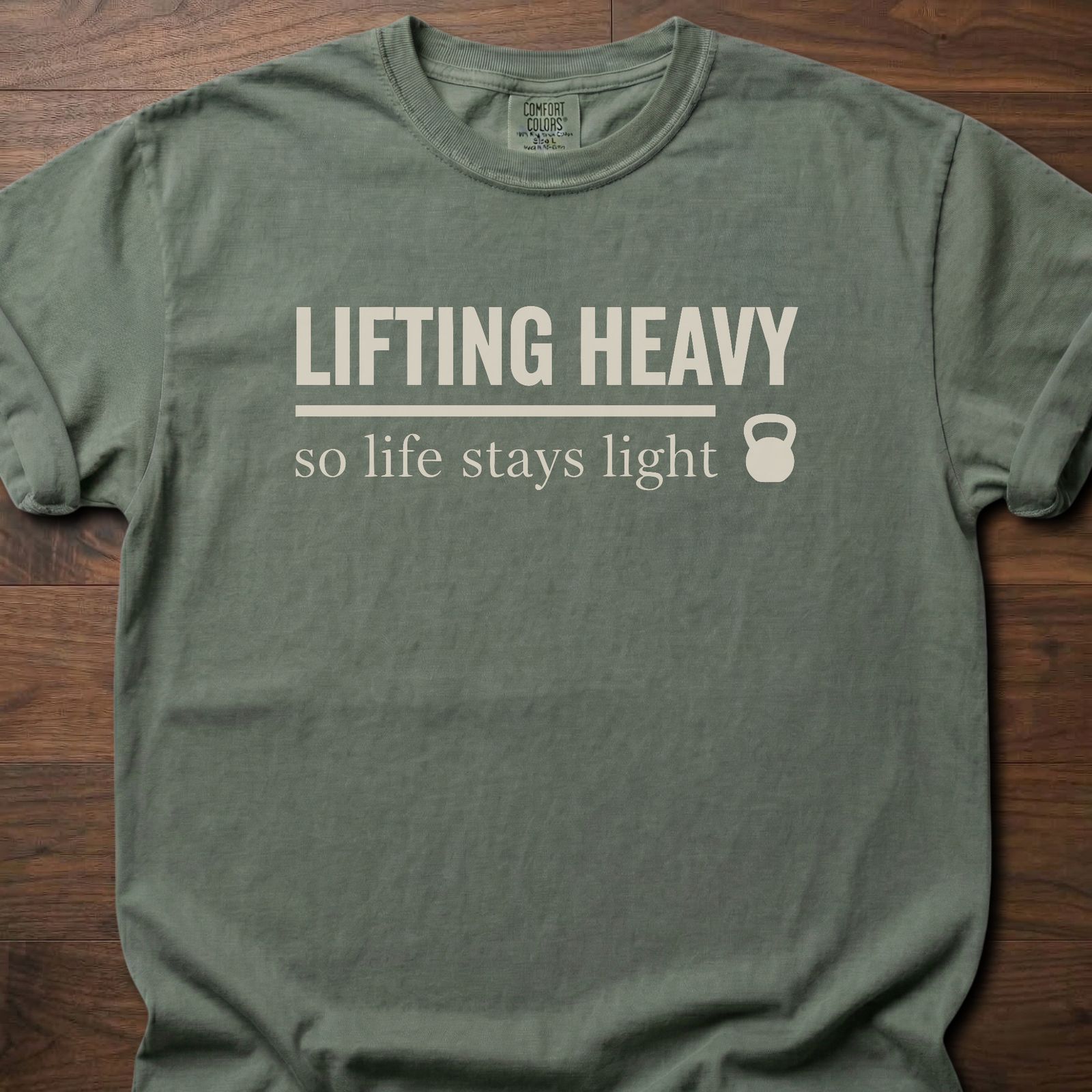 Life Stays Light strength training t shirt with kettlebell and motivational lifting message – Moss