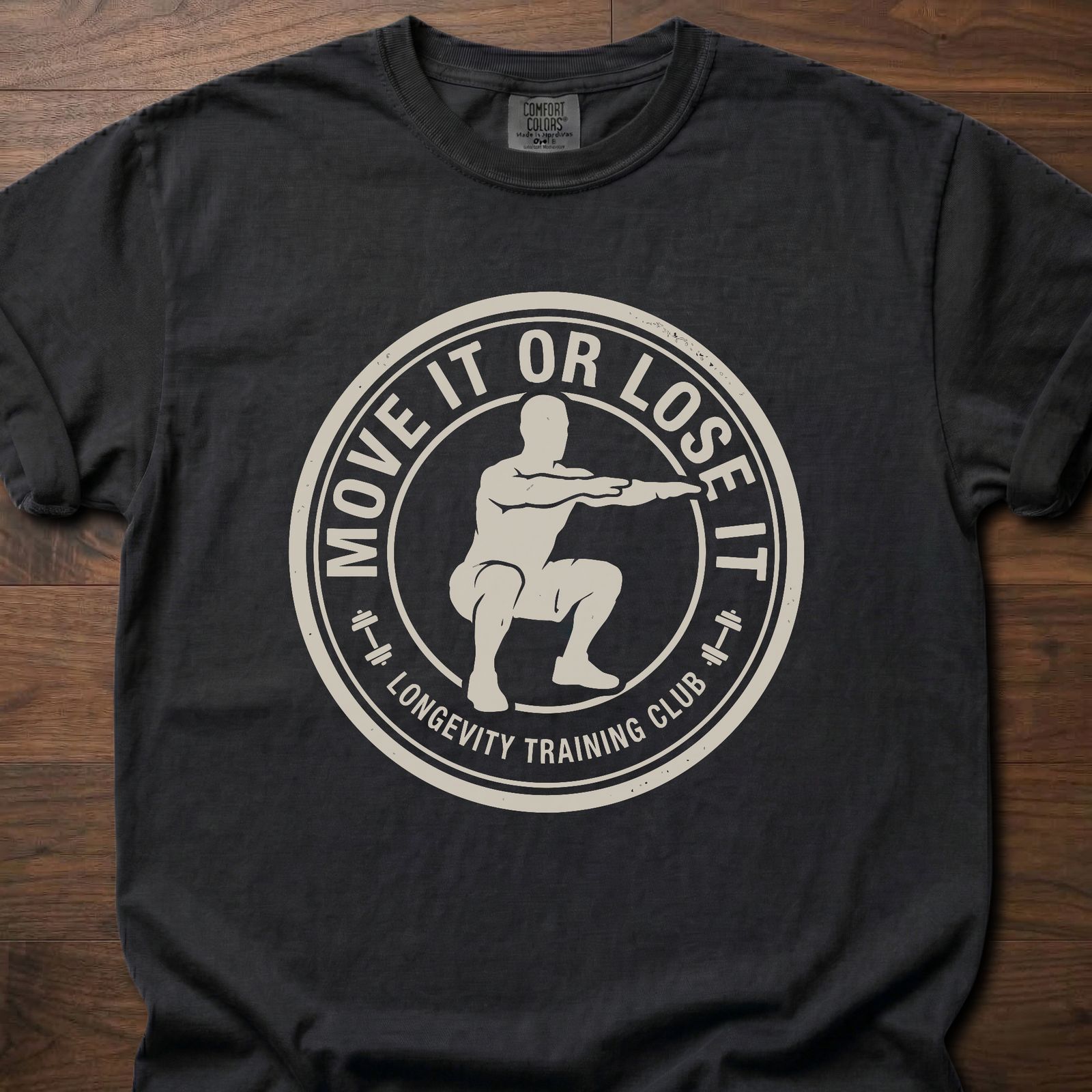 Move It Or Lose It fitness lifestyle apparel featuring figure doing squat inside circular badge design – Black