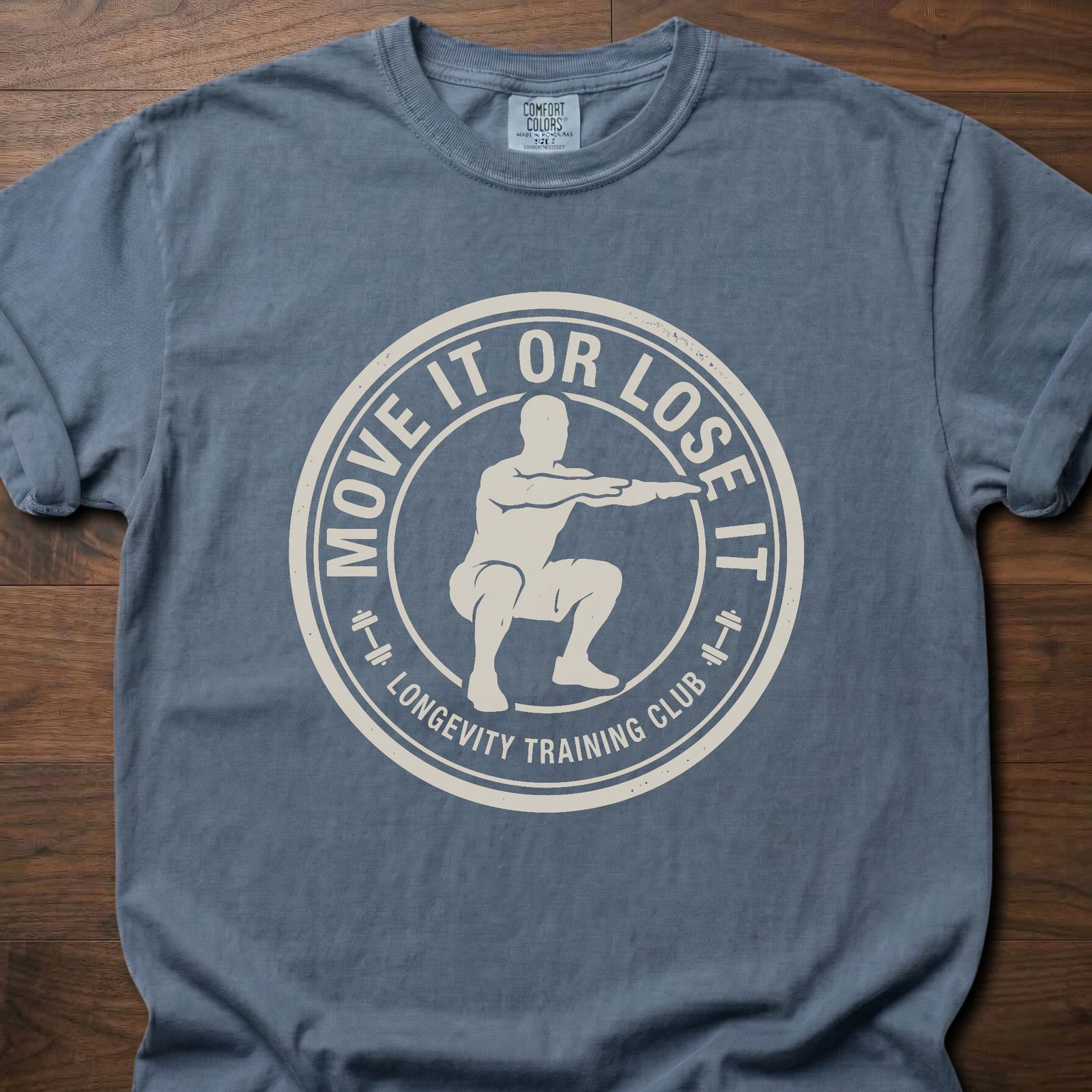 Move It Or Lose It fitness lifestyle apparel featuring figure doing squat inside circular badge design – Blue Jean